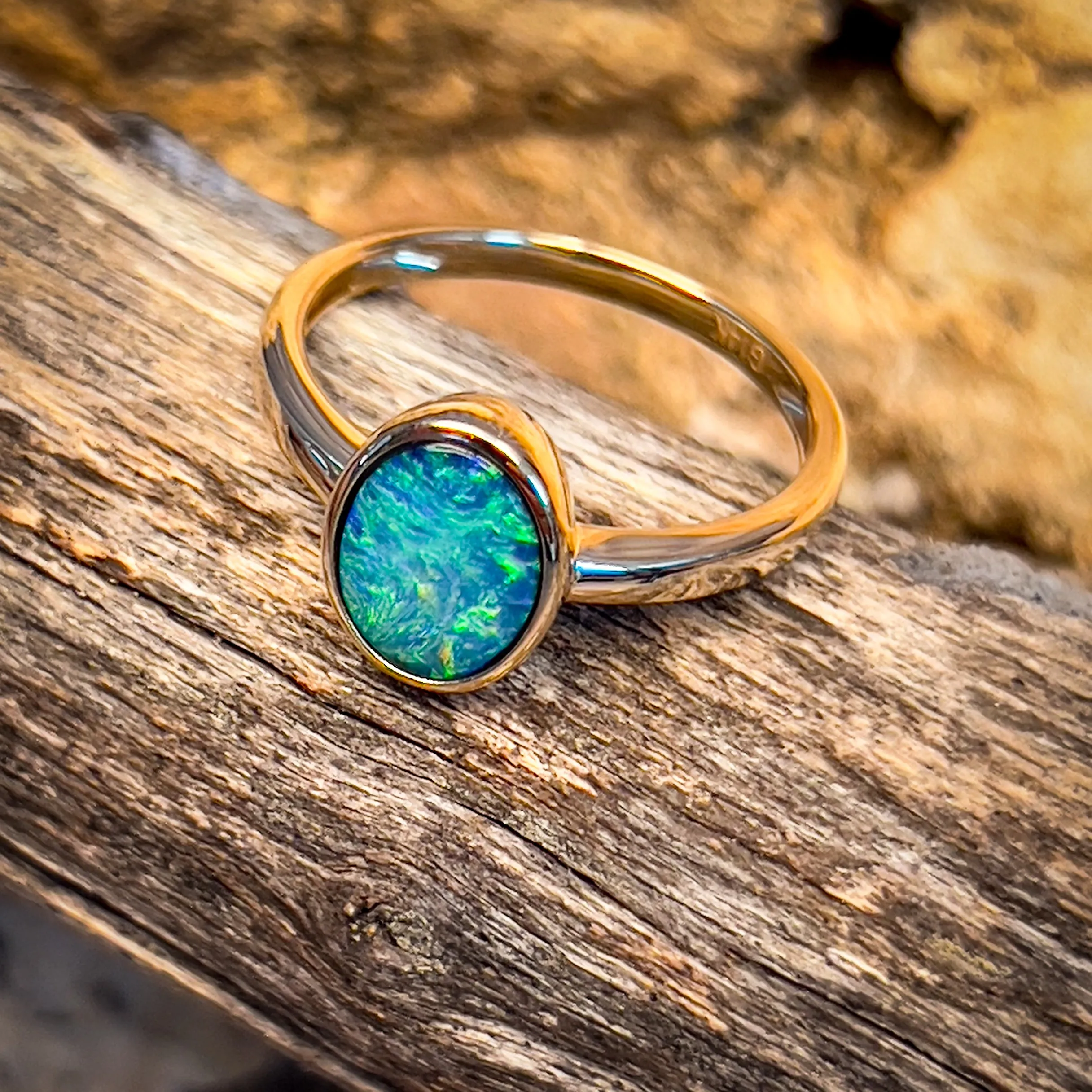 14kt Yellow Gold Black Opal 1.11ct bezel set ring