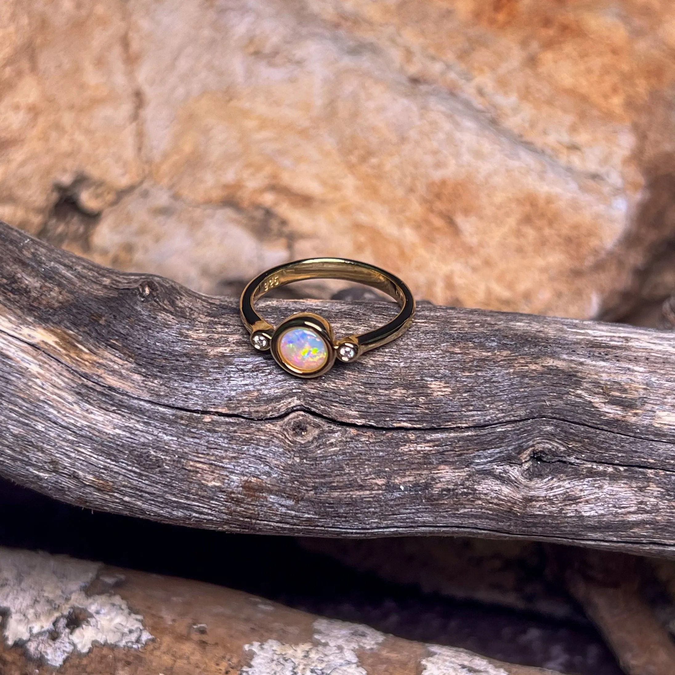 Gold Plated Sterling Silver White Opal 6mm round and two cubic zirconia ring