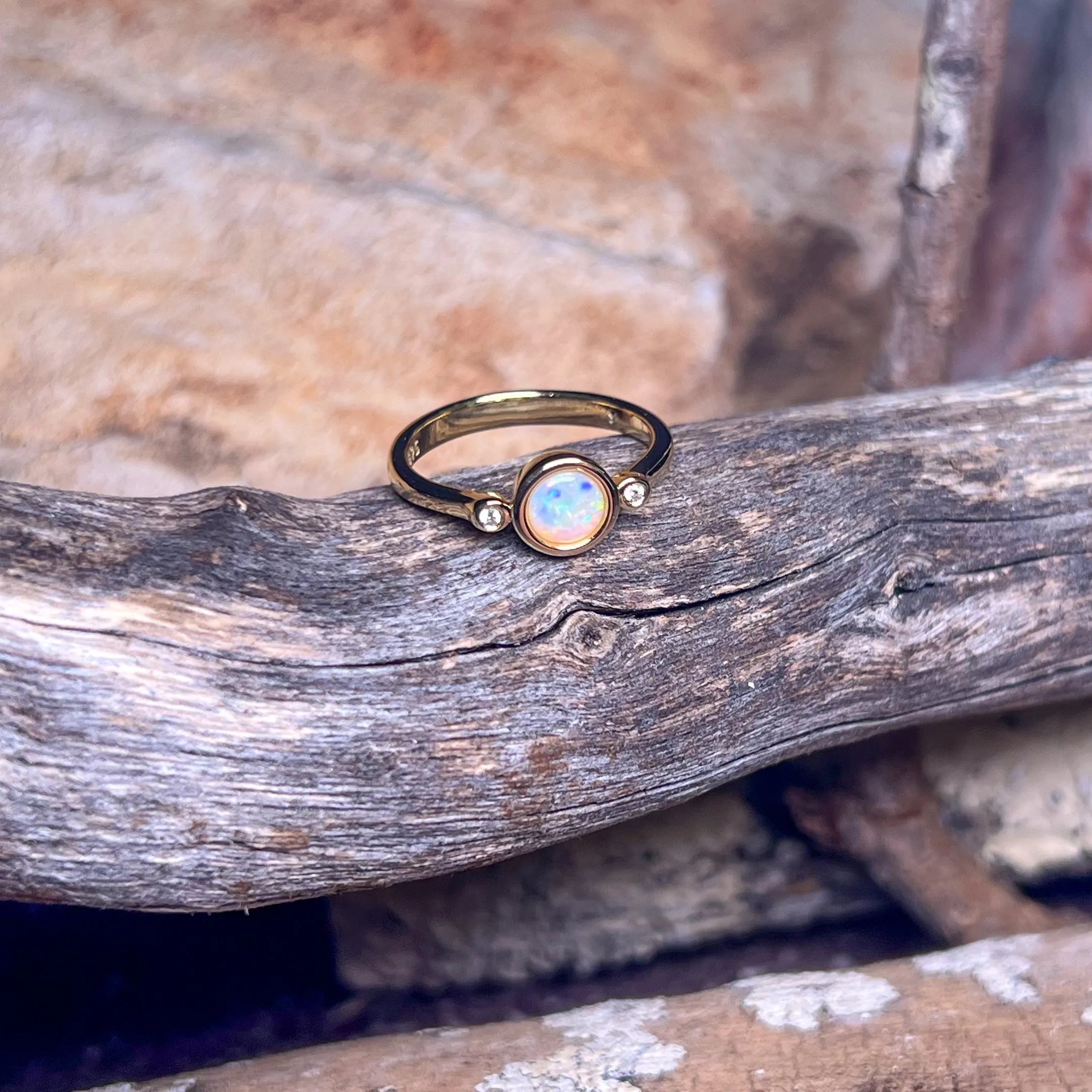 Gold Plated Sterling Silver White Opal 6mm round and two cubic zirconia ring