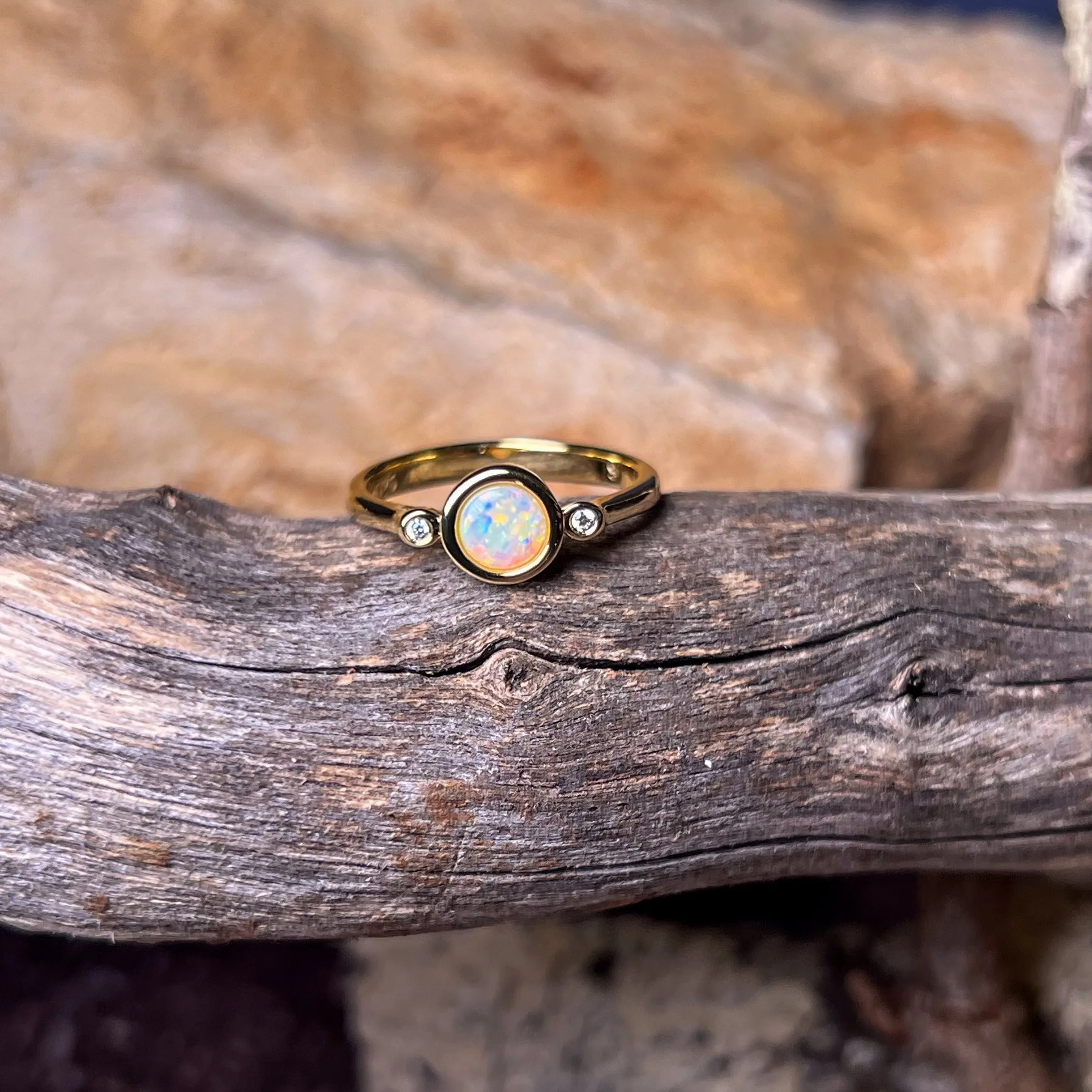 Gold Plated Sterling Silver White Opal 6mm round and two cubic zirconia ring