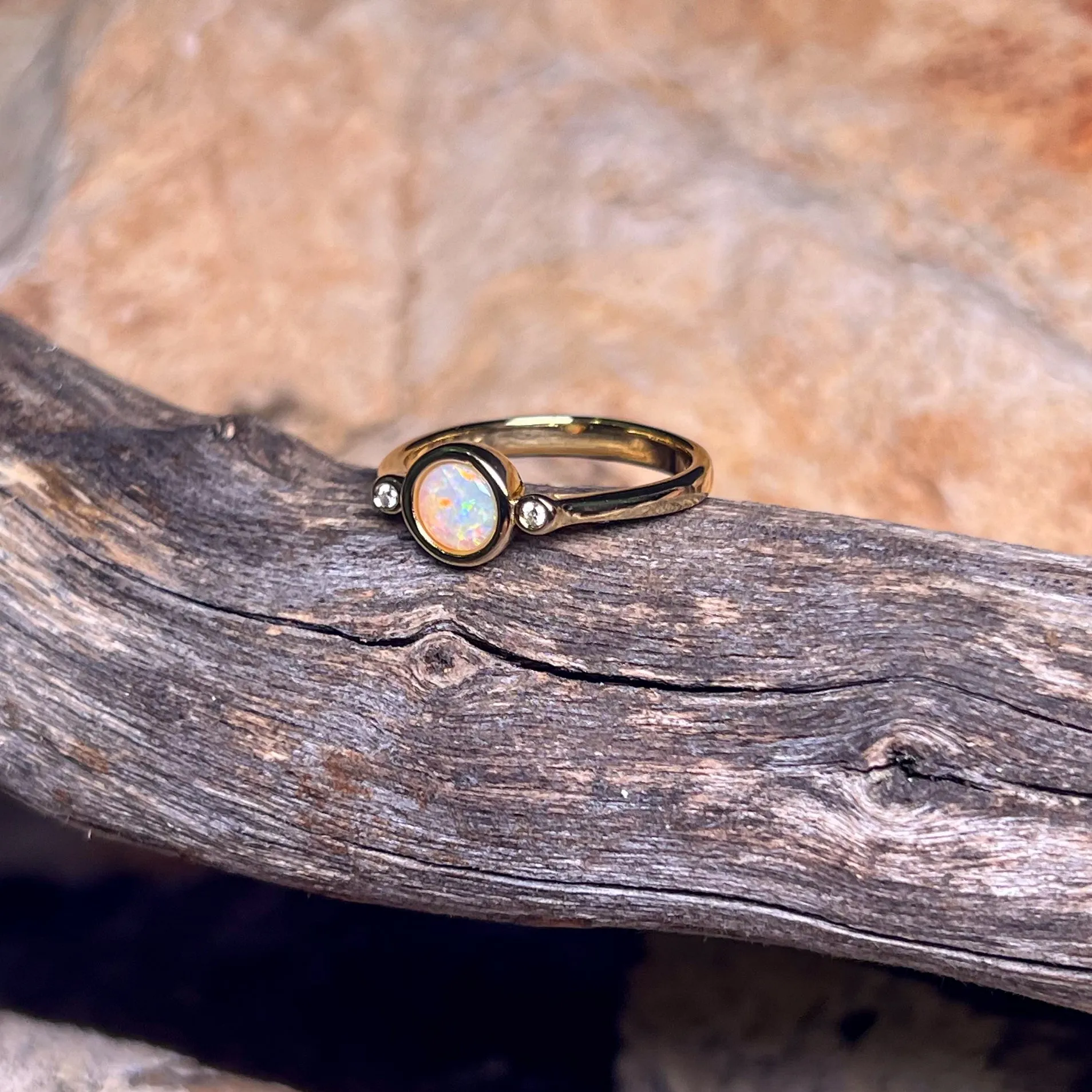 Gold Plated Sterling Silver White Opal 6mm round and two cubic zirconia ring
