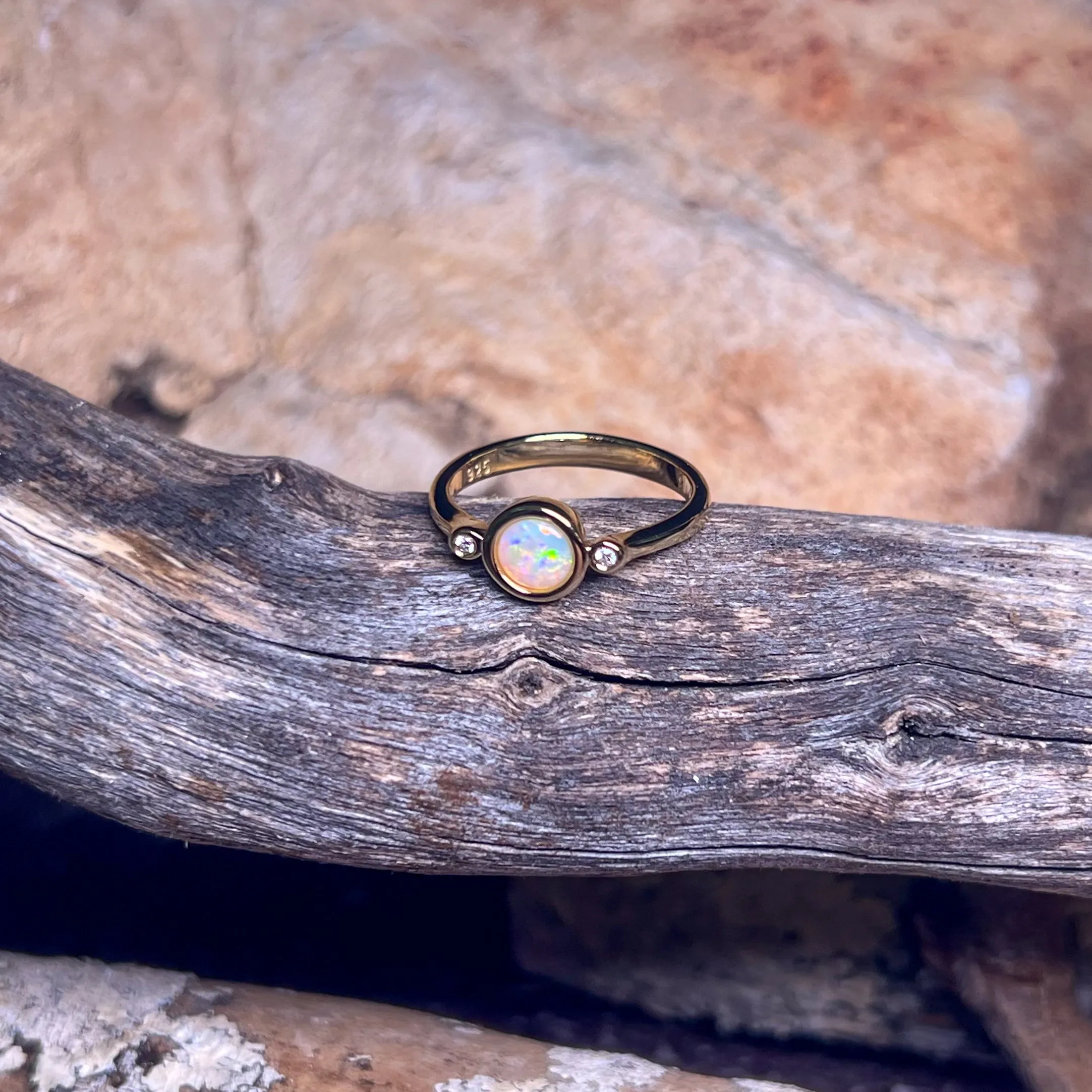 Gold Plated Sterling Silver White Opal 6mm round and two cubic zirconia ring
